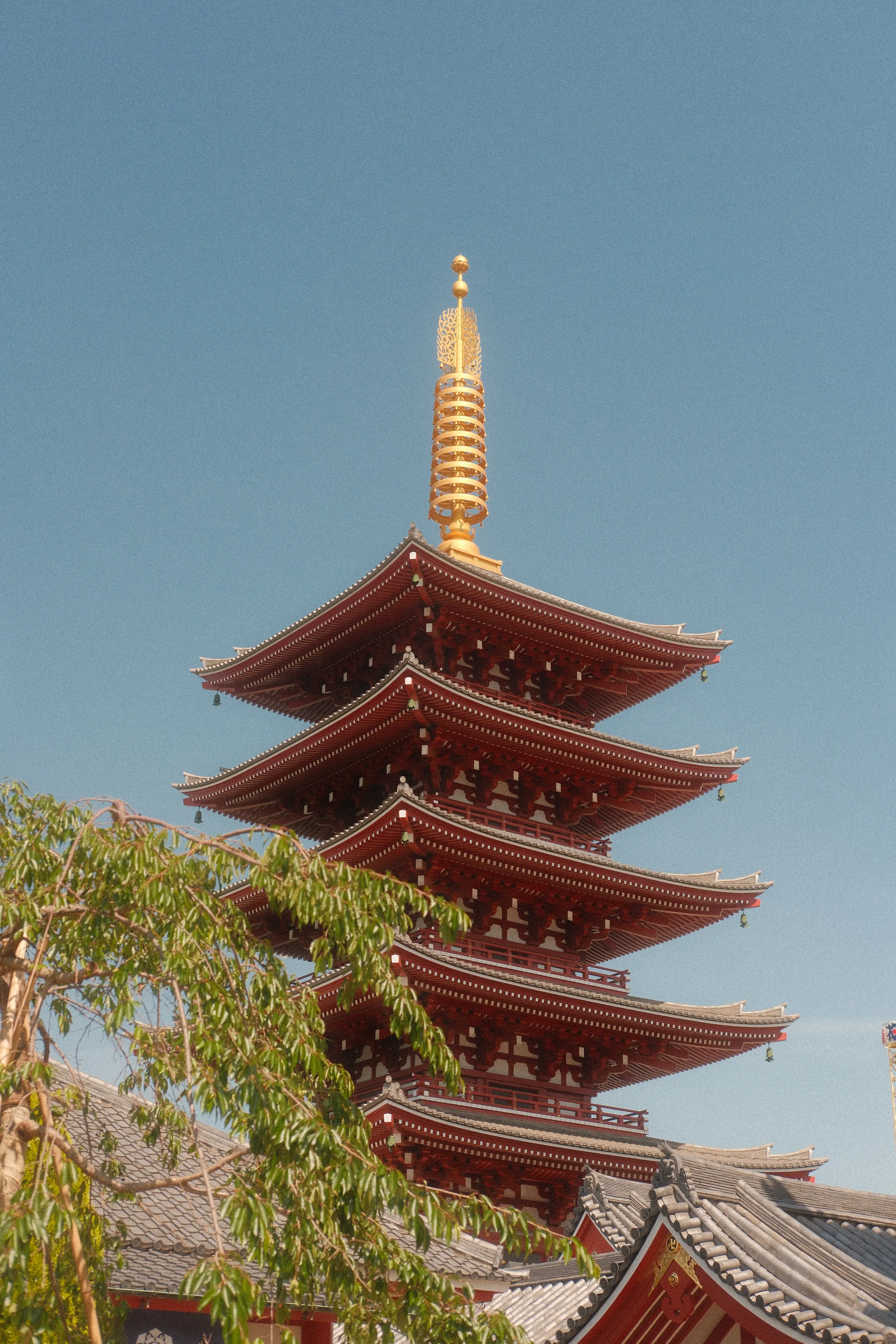 The five-storey pagoda at Senso-ji against a clear sky