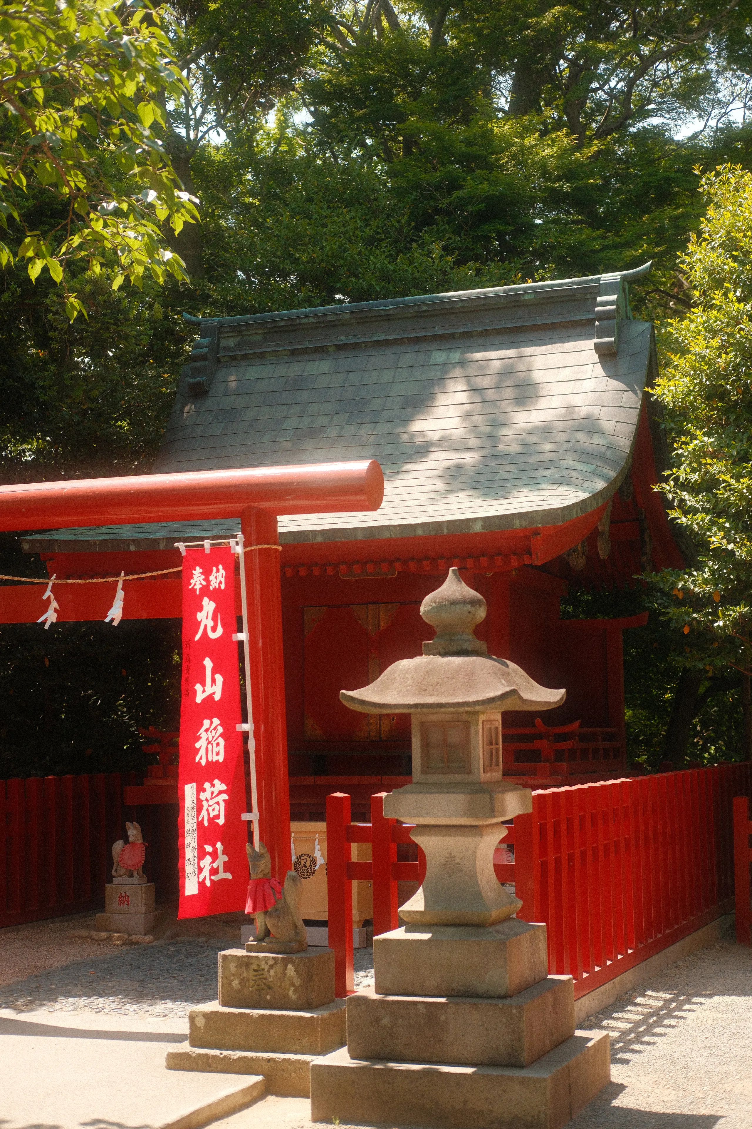 Maruyama Inari shrine with a stone lantern and red fence