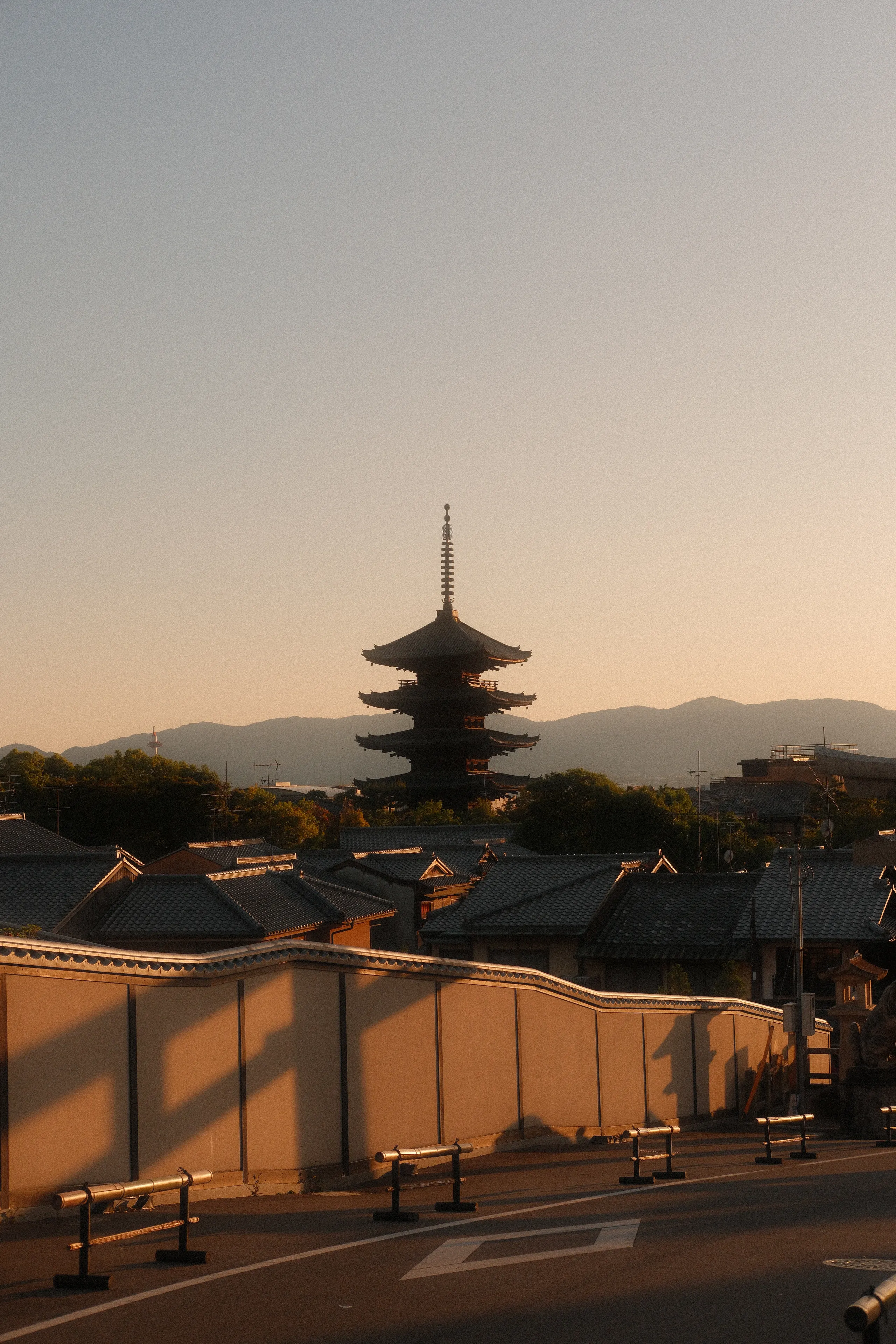 The Yasaka pagoda above Kyoto's rooftops at sunset