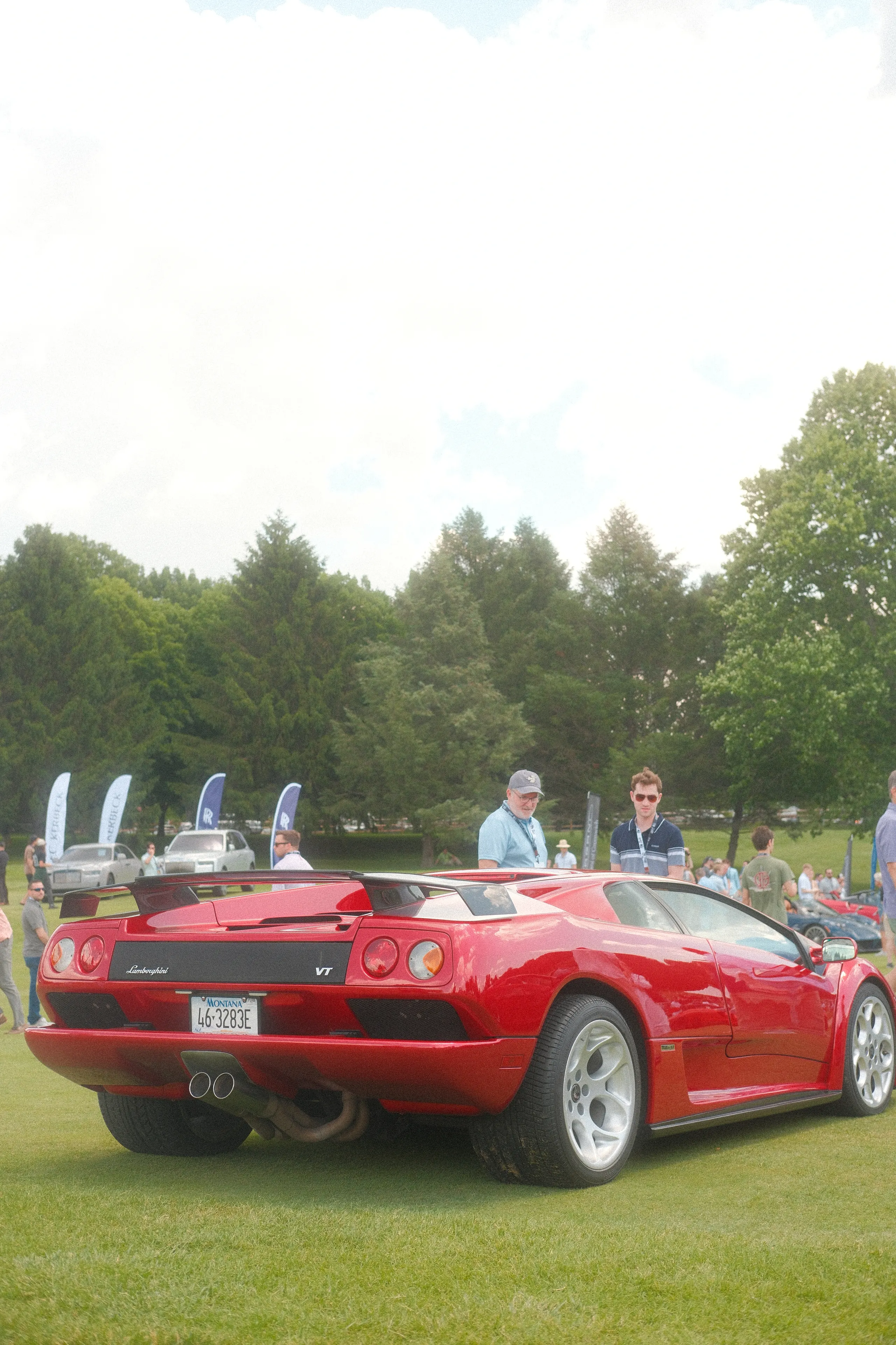A red Lamborghini Diablo on the lawn at a car show