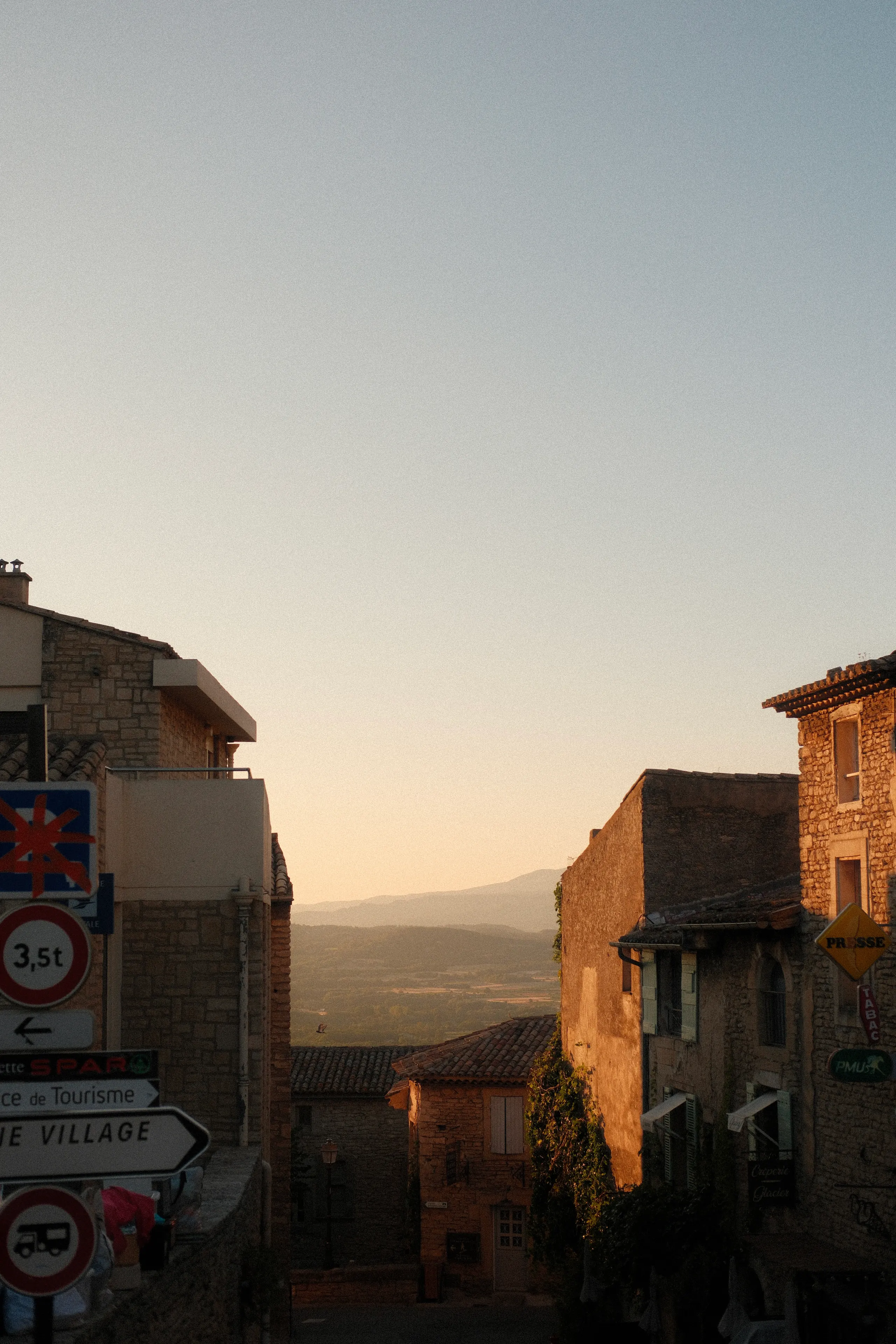 Stone houses at the edge of Gordes in evening light